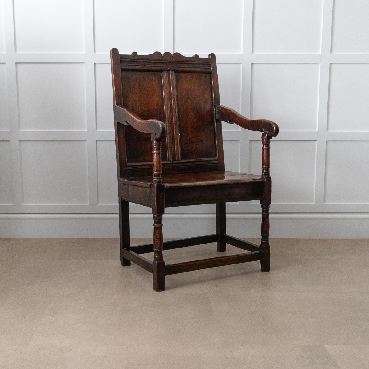 A Charles II joined oak double-panel back open armchair, circa 1660