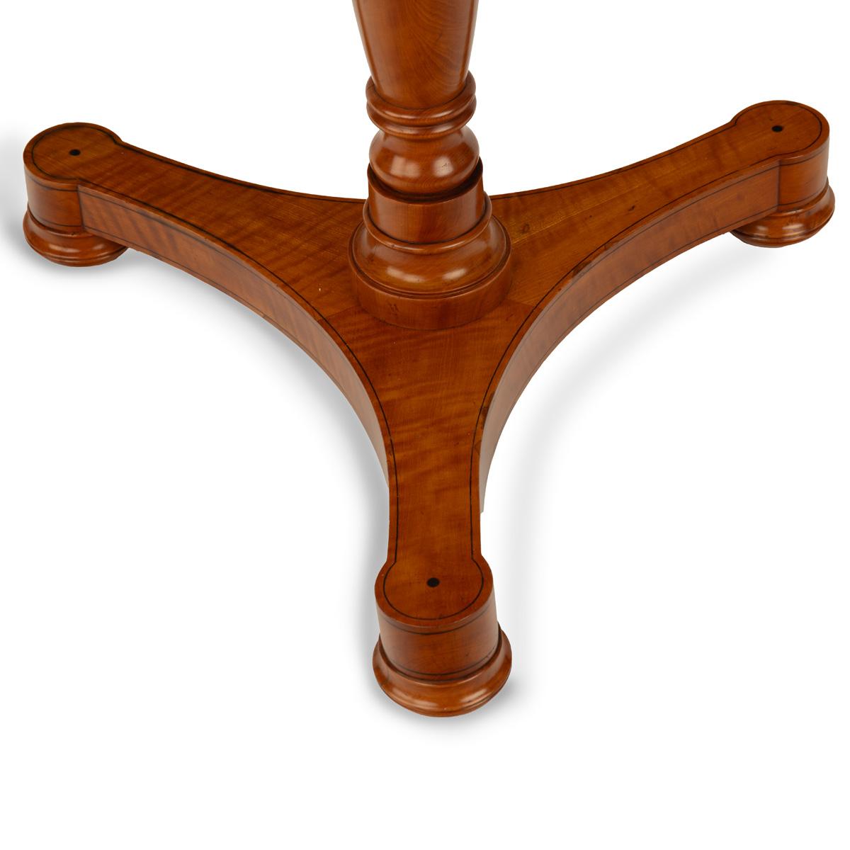 A satinwood hexagonal tilt-top table
