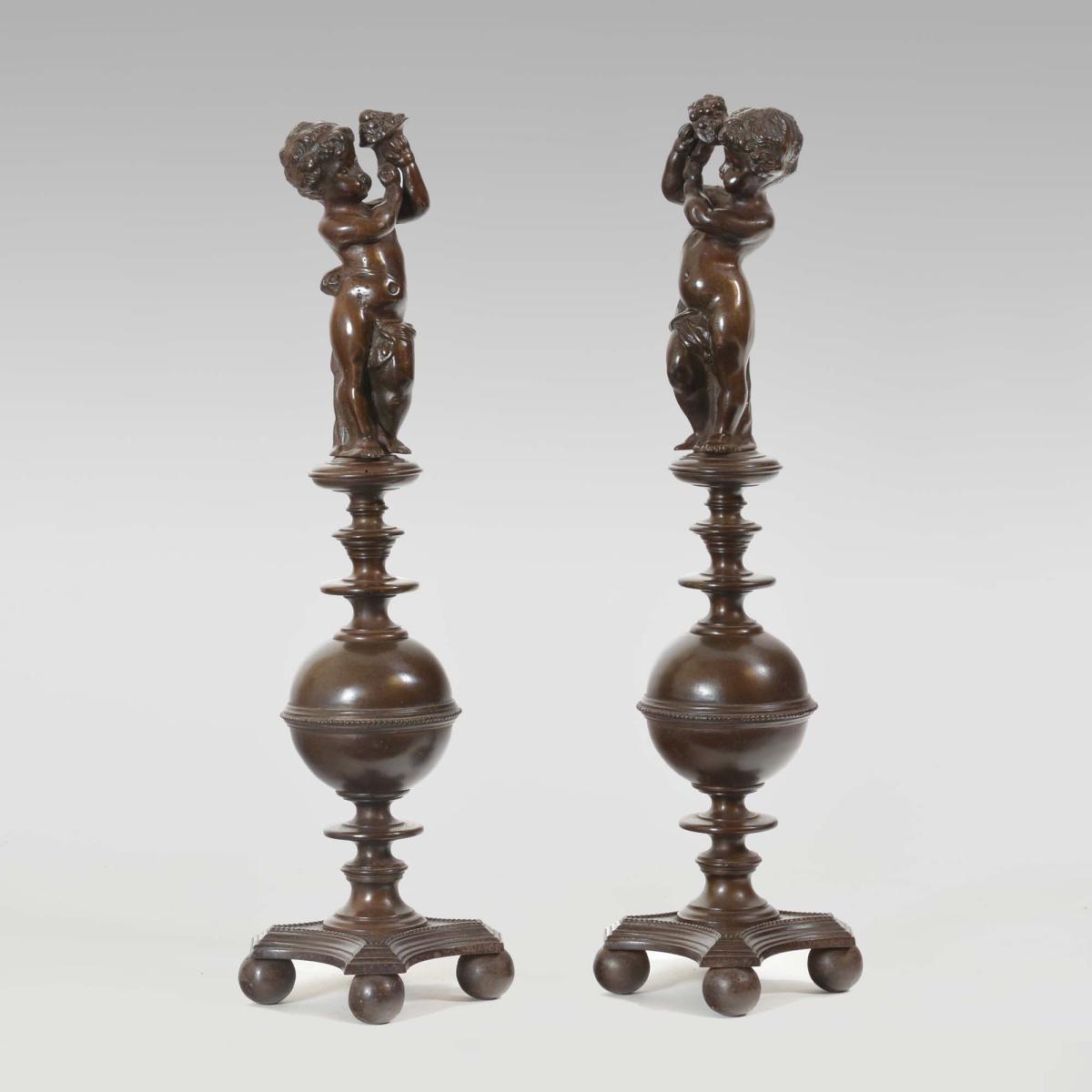 A pair of bronzed cast iron Renaissance style Italian andirons