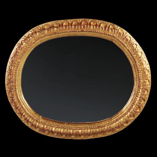 An 18th Century Spanish Carved Oval Giltwood Mirror