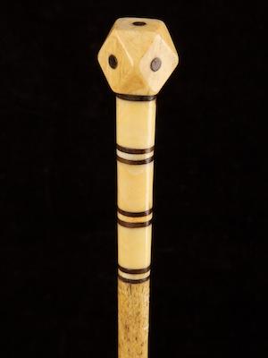 A whaler-made whalebone cane with decorative washers and octagonal dot inlaid handle_a