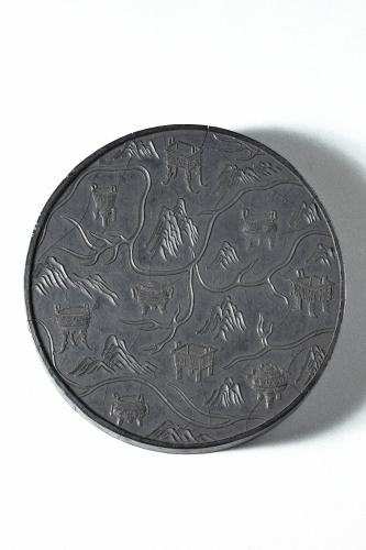 Circular ink cake with mountains and dragons, inscription Ming Fang Yulu zhi, Chinese, Qing dynasty, late 19th century.