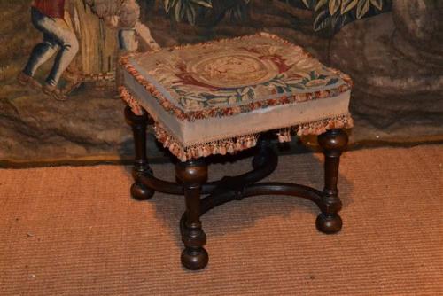 A tapestry covered walnut stool