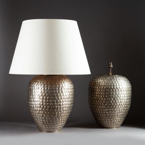 A Pair of Large Silvered Punched Metal Lamps