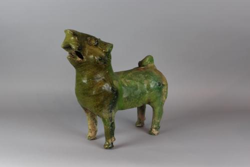 A Chinese Pottery Green Glazed Model of a Barking Dog, Eastern Han Dynasty