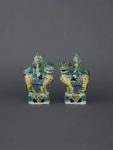 Pair of Chinese famille verte biscuit porcelain groups of Middle Eastern merchants, Early Kangxi, circa 1680