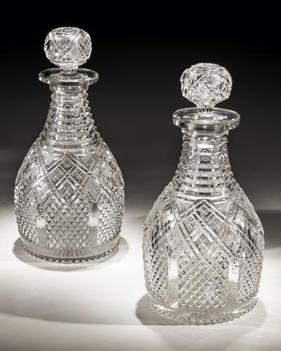 A Fine Pair of Step & Diamond Panelled Cut Glass Magnum Regency Decanters