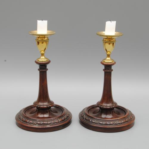 A Pair of Late 18th Century Mahogany and Brass Candlesticks