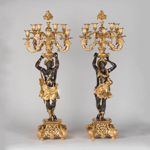 An Important Pair of Patinated and Gilt bronze Figural Candelabra by Denière of Paris & Henri Picard