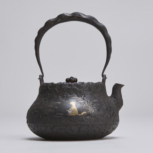 A late 19th Century Iron Tetsubin (kettle) with Inlaid decoration of Tanuki