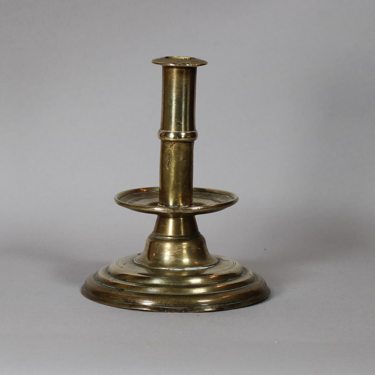 Brass trumpet-form candlestick, 17th century | BADA