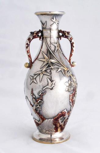 An Elkington aesthetic silver and copper English vase