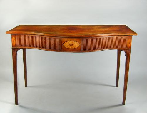 George III mahogany serpentine fronted serving table with fluted frieze and legs, and shell inlays, c.1790