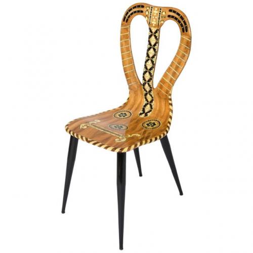 A “Musicale” chair by Atelier Fornasetti.