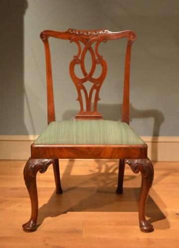 A carved mahogany cabriole leg side chair