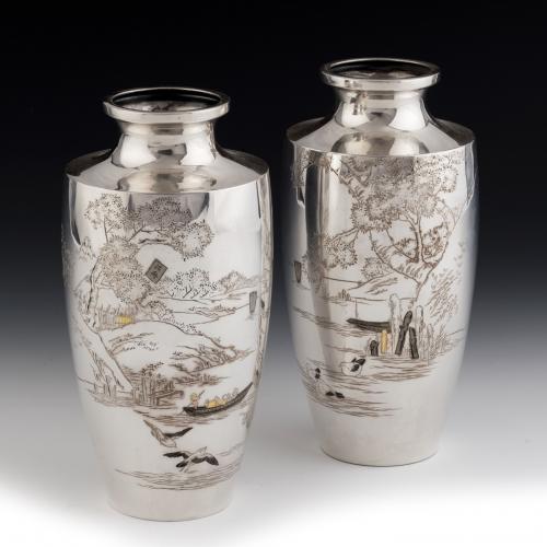 A pair of Taisho period silver vases