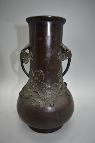 Slender form bronze foliage vase