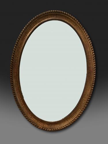 George III oval Adam giltwood mirror with original gilding