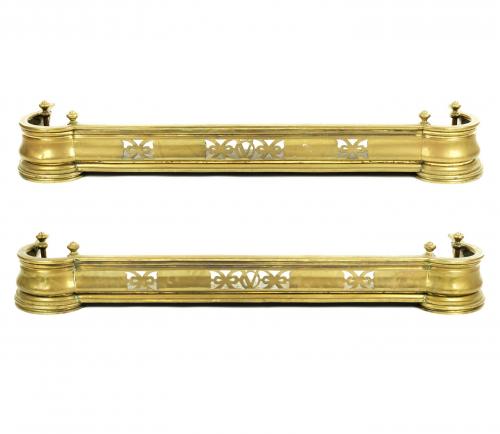 A pair of late Victorian brass kerb fenders