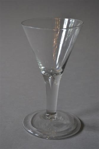 A large mid 18th century English wine glass