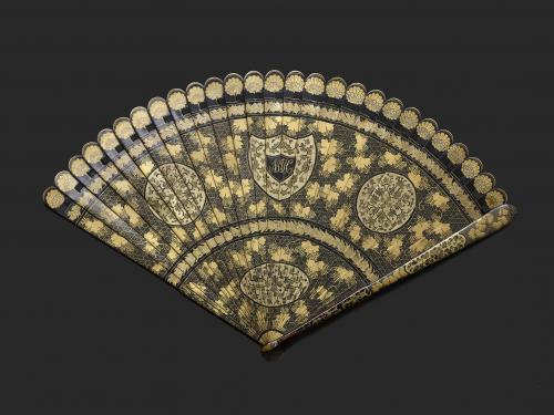 A Chinese Export Black and Gold Lacquered Brise Fan, Qing Dynasty, Jiaqing Period, Circa 1800