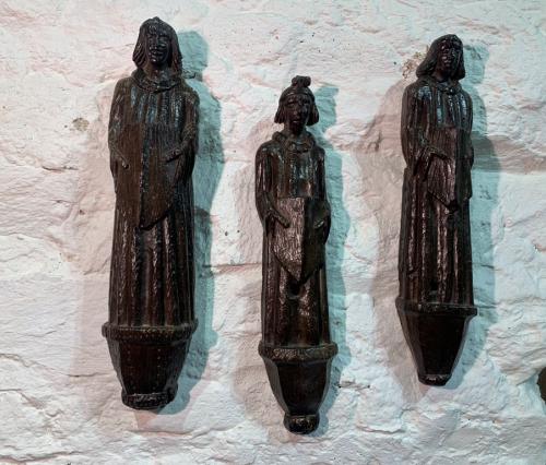 AN EXTREMELY RARE TRIO OF 15TH CENTURY ENGLISH OAK ROOF ANGELS. CIRCA 1470.