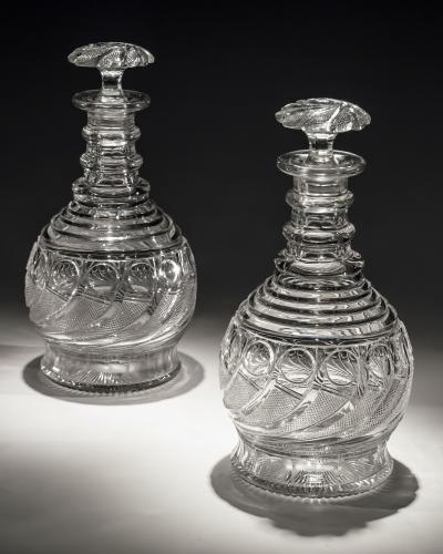 An Exceptional Pair of Swirl Cut Regency Decanters with Swirl Cut Stoppers