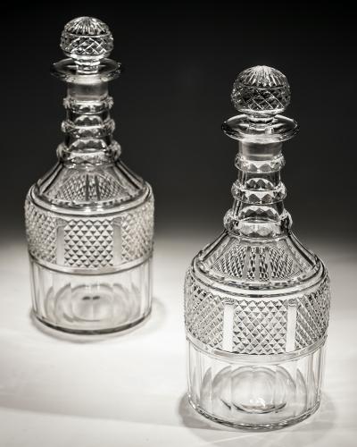A Fine Pair of Slice and Diamond Cut Regency Decanters