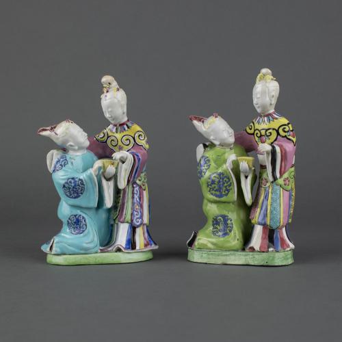 A fine and rare pair of Chinese export porcelain famille rose groups of lovers,