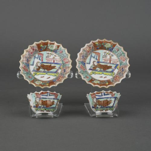 A pair of Chine porcelain famille rose European subject fluted tea-bowls and saucers, Early Qianlong, circa 1750