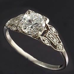 Diamond centre stone ring with diamond shoulders