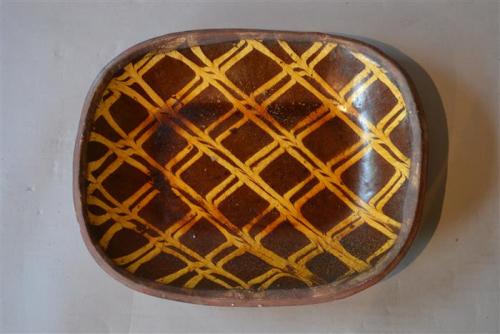 A Georgian lattice pattern slipware dish
