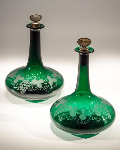 A Pair of Victorian Green Mells Decanters Engraved With Fruiting Vines