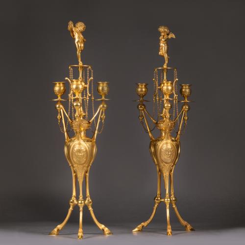 A Pair of Napoleon III Neo-Etruscan Style Gilt-Bronze Three-Light Candelabra by Henri Picard.  French, Circa 1870.