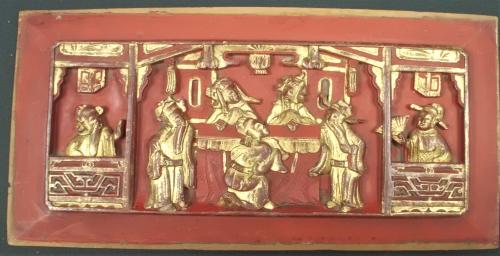 gilded wood panel carved with a Chinese scene