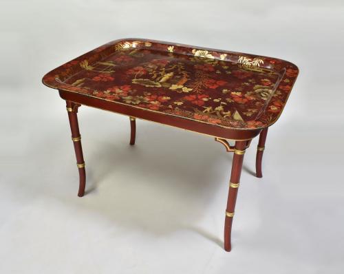 Regency red ground papier mache tray on later stand, circa 1810