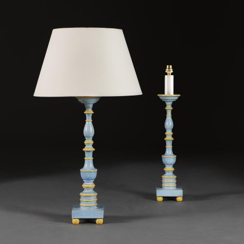 A Pair of North Italian Painted Candle Sticks