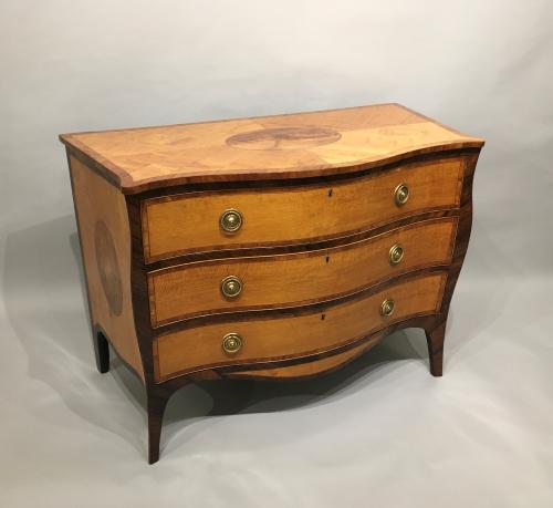 An Important 18th Century Satinwood Serpentine Commode. George III, Circa 1780