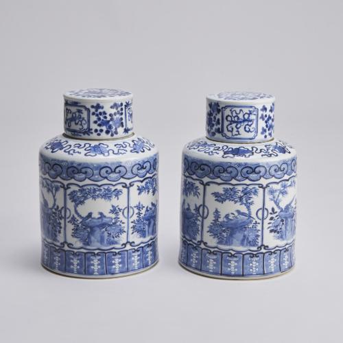 A pair of 19th Century Chinese Blue and White covered jars with depictions of the eight treasures