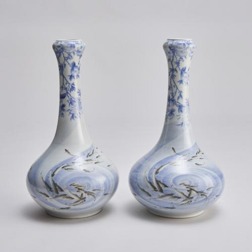An attractive pair of early 20th Century Japanese vases with cherry blossom and grey salmon decoration