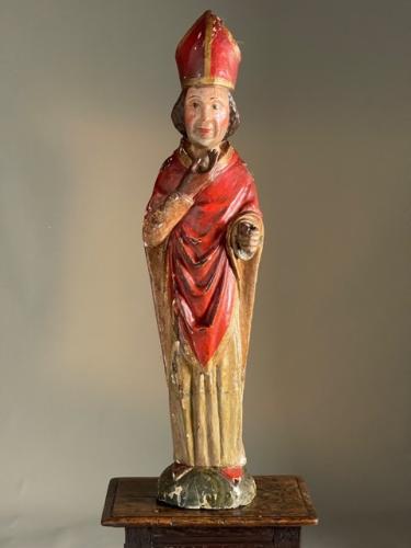 C1600 wood carving of a cardinal