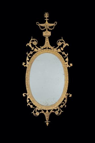 Thomas Coulborn and Sons George III Carved Giltwood Oval Mirror after designs by Robert Adam