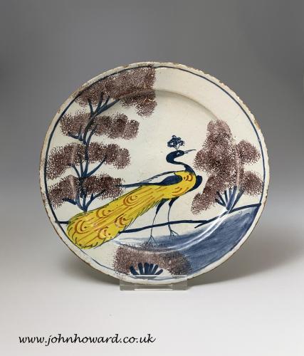 English polychrome decorated delftware peacock plate Bristol circa 1735