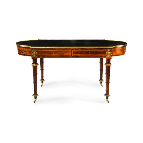 A Regency ormolu mounted rosewood two drawer writing table in the manner of John McLean and Gillows of Lancaster