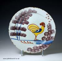 English delftware pottery Farmyard plate with figure of a rooster, early 18th century English